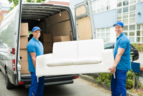 Removal team handling household furniture in Aldwych